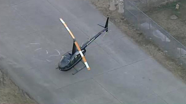 R44 after autorotation to ground - note markings on ground